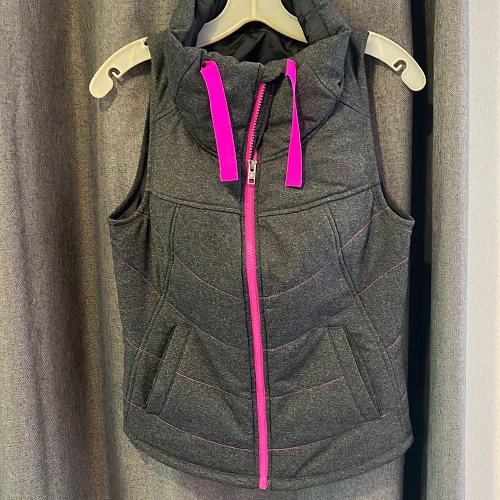 New condition North Face vest, dark grey with pink detailing